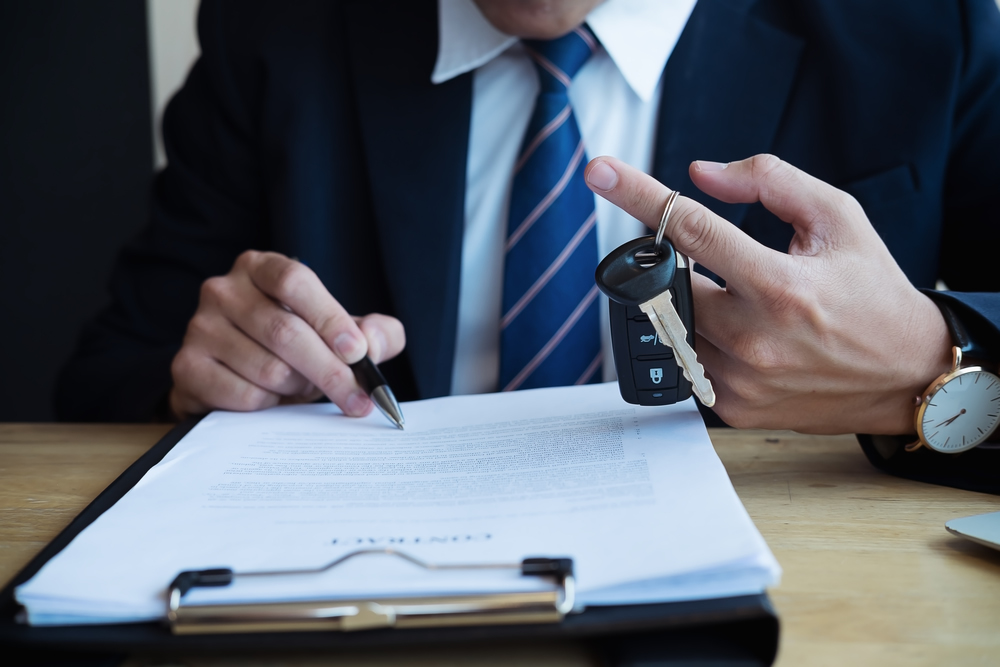 Auto dealer completing dealer license application