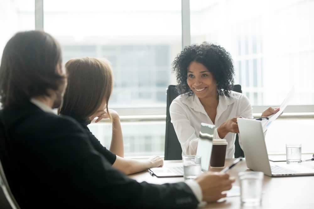 Startup businesswoman pitching customers in a conference room