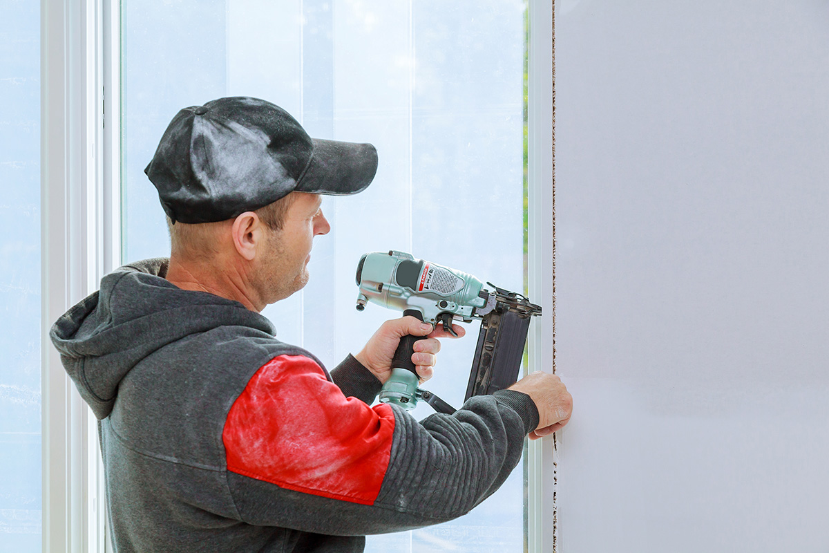 Carpenter working with a nailer