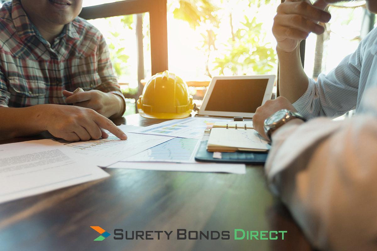 Contractor reviewing a project documents and payment bond