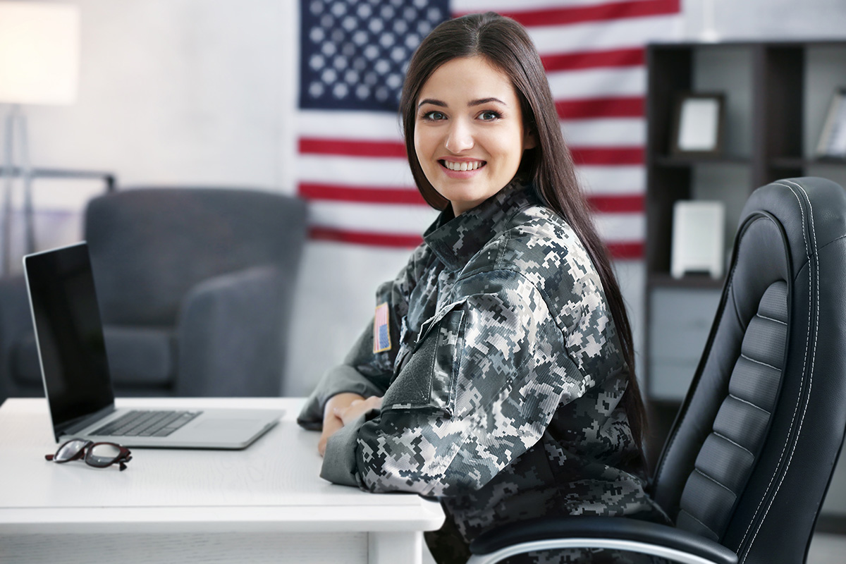 Veteran at a desk working on laptop