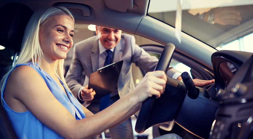 Woman talking with dealer